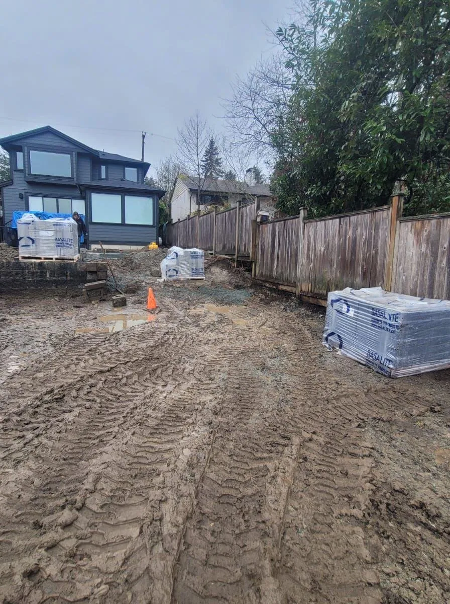 Backyard before: excavated mud and stacked materials